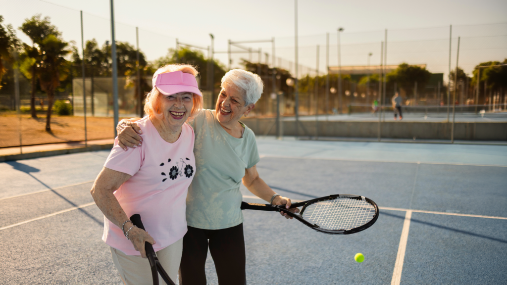 older-women-playing-tennis-enjoying-beautiful-day-friendship